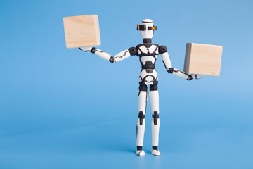 Robot holding two wooden cubes like on scales, comparing variants