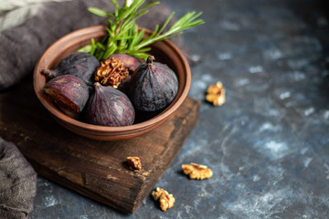 Ripe, beautiful, purple figs. Sweet and juicy. Mediterranean fruit is very healthy. You can jerk and cook jam. There is empty space on a dark copyspace background. Food for vegetarians. 