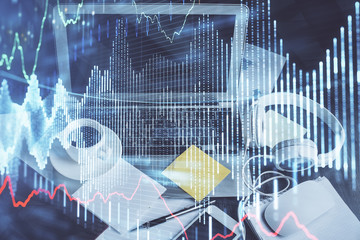 Financial chart drawing and table with computer on background. Multi exposure. Concept of international markets.