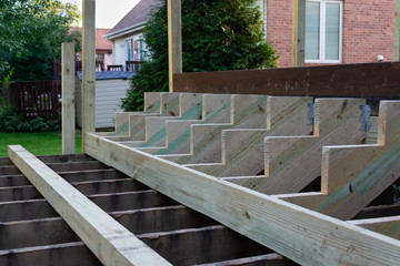 Structure of New Stairs being Constructed on a Backyard Home Deck