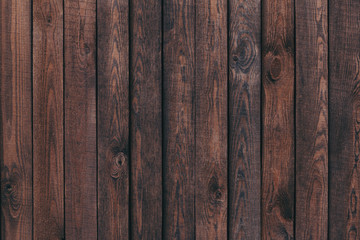 Dark brown wood texture or background.