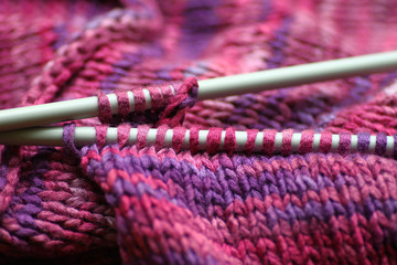 Knitwear and knitting needles.