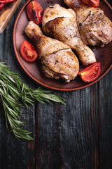 delicious and nutritious dinner for the whole family, a few pieces of chicken on a plate, drumsticks grilled,