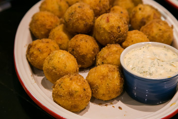 chicken balls with breadcrumbs and a ranch dressing