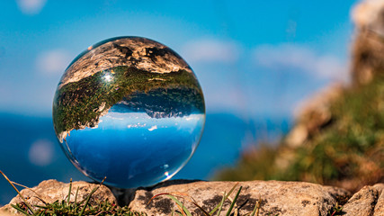 Fototapeta premium Crystal ball alpine landscape shot at the famous Kitzbüheler Horn, Kitzbühel, Tyrol, Austria