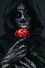 Female death with red flower