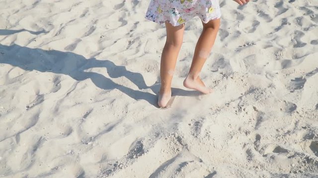legs of a little girl playing in a squeak