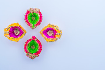 Indian festival Diwali, Diya oil lamps lit on colorful rangoli. Hindu traditional. Happy Deepavali.