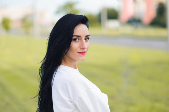 Portrait of a beautiful athletic girl. beauty and health concept. Brunette in white maik and black ragged lazin