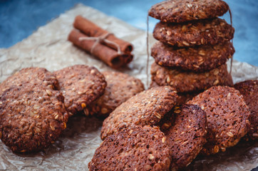 Homemade healthy oat cookies with cinnamon on brown parchment. Healthy food concept. Healthy snack