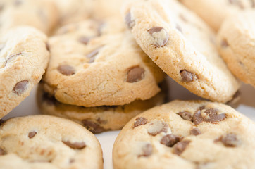 Lots of chocolate chip cookies. Close-up on baking. Delicious homemade dessert.