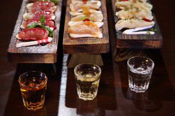 Dumplings with potato in sour cream on a wooden board.  Dumplings with mushrooms. Dumplings with cherries.