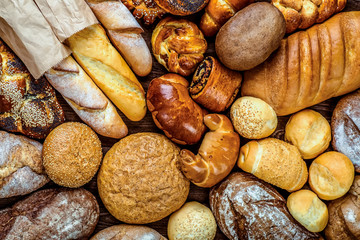 Fresh fragrant bread on the table. Food concept - obrazy, fototapety, plakaty