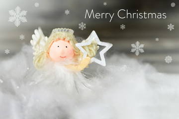 Christmas angel holding star. Merry Christmas card 