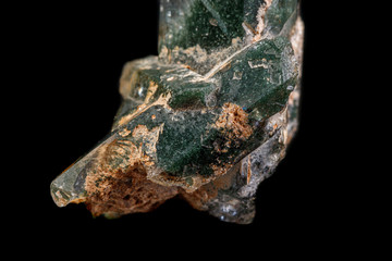 macro Axinite mineral stone on a black background