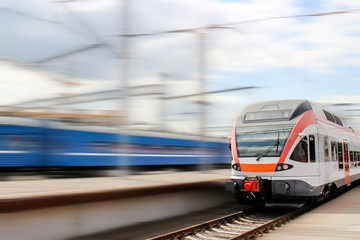 Train on railway station on blured background