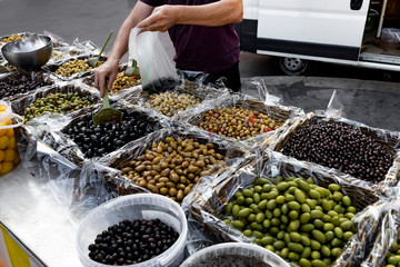 Marinated stuffed olives sold in the market.