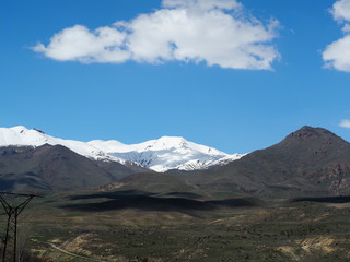 Mountains covered with snow and cloud shadows, Armenia