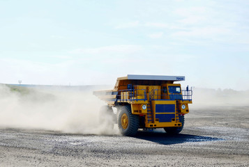 Giant mining dump truck, after being discharged from the conveyor, is tested at the factory test site. Heavy-duty truck manufacture by the heavy vehicle plant. © MaxSafaniuk
