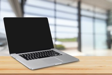 Laptop with blank screen on background