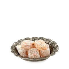 Turkish Delight on a plate isolated on white background. Free space for text.