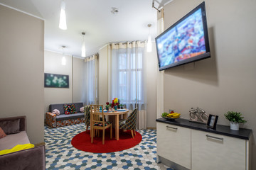 Modern interior of light studio apartment. Living room.