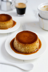 Caramel flan, crema catalana dessert on white woden table