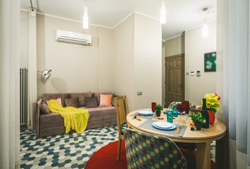 Modern interior of light studio apartment. Living room. Filtered.