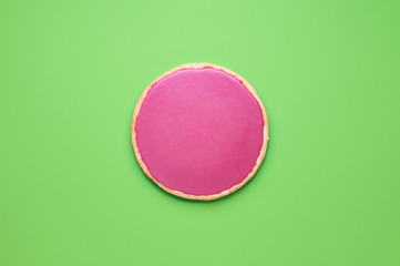 Pink chocolate whole pie on green tabletop. Christmas dessert