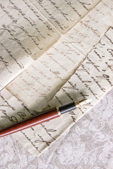 fountain pen lies on manuscript from old paper