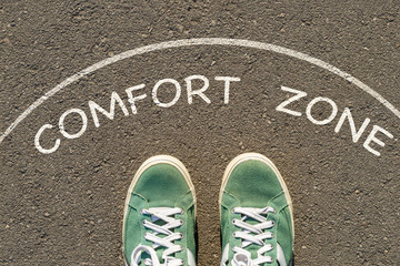 photo on top of the sneakers and the inscription comfort zone on the asphalt, the concept of...