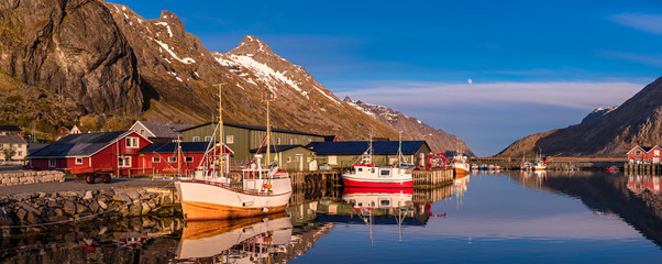 Ramberg village, Lofoten Islands, Norway, Fishing boats in harbor at midnight sun, Mountain With...