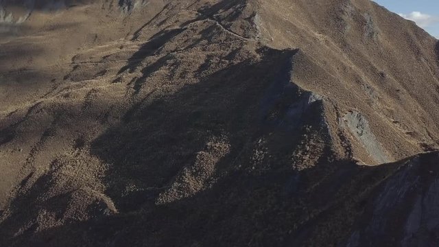Range of peaky mountains in sunshine