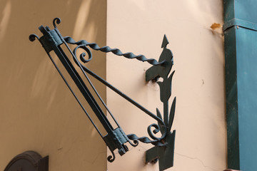 Forged holder for flag or torch in the corner of the building, w