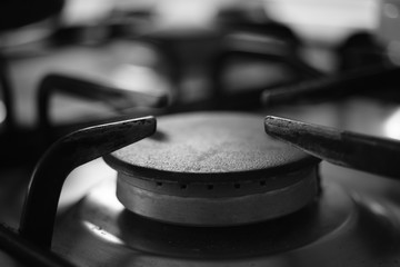 Gas stove burner. Black and white photo.