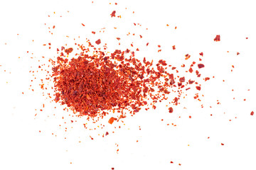 Close-up shot of crushed red chili pepper flakes isolated on white background, top view.