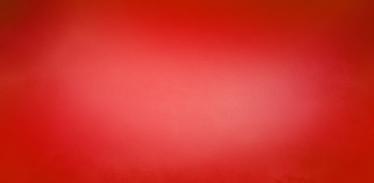 Red Christmas background with soft blurred texture design, abstract blurry red background with light center and dark borders