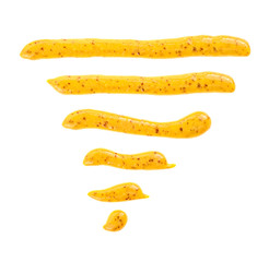 Mustard sauce. Strips of mustard on a white background, top view.