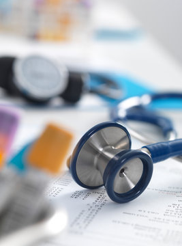 Health Screening, A stethoscope on a patients blood results after a a consultation