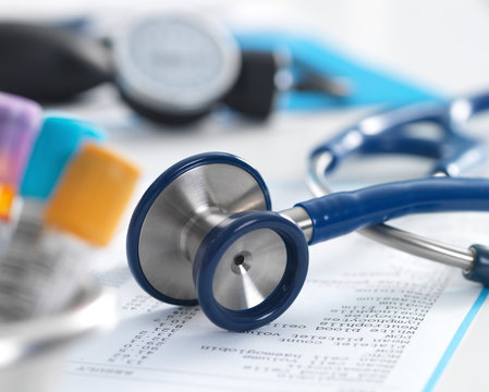 Health Screening, A stethoscope on a patients blood results after a a consultation