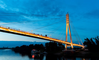Fototapeta na wymiar The bridge of lovers Tyumen. Evening view