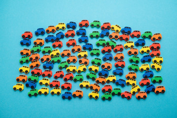 mini toy rubber cars on blue background