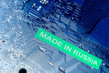 close-up. motherboard in blue. the inscription is made in Russia.