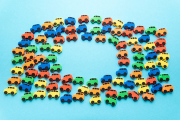 mini toy rubber cars on blue background