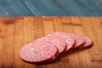 Sausage cut into slices on a cutting Board