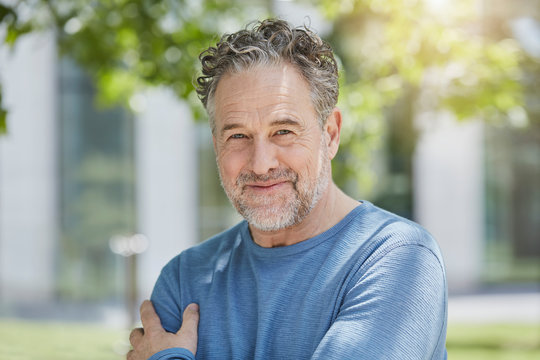 Portrait of confident mature, man in a park - Powered by Adobe