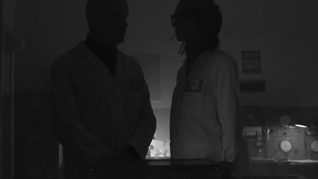 Scientists opening a briefcase in the lab