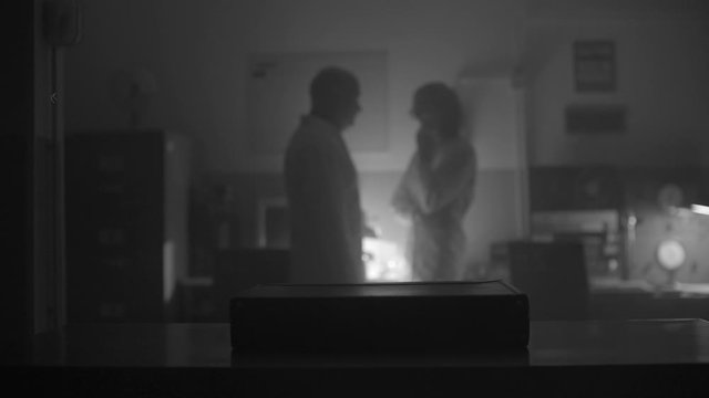 Scientists opening a briefcase in the lab