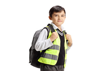 Little boy with backpack and safety vest