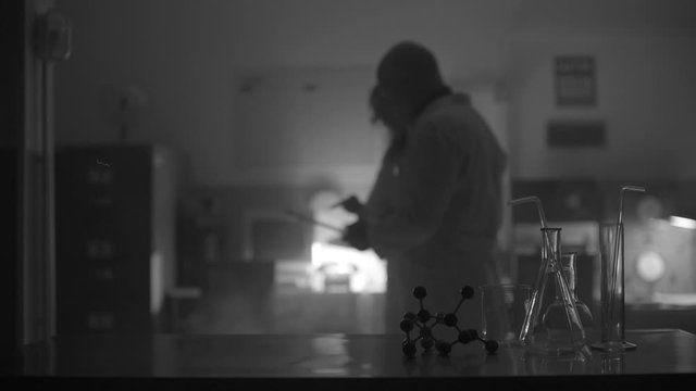 Scientists working together in a dark lab